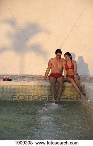 Stock Photo - Young Couple Sitting By Jacuzzi, Mayan Riviera, Yucatan Peninsular, Quintana Roo State, Mexico. Fotosearch