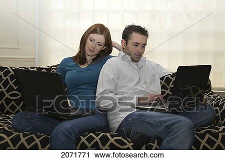 Young Couple Using Laptops, Whitby, Ontario View Large Photo Image Stock Image - Young Couple Using Laptops, Whitby, Ontario. Fotosearch