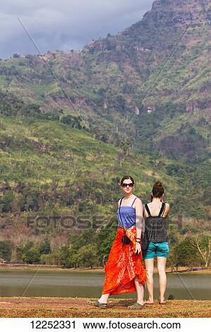 Young female tourists visiting Wat Phu temple; Wat Phu, Laos View Large Photo Image Stock Image - Young female tourists visiting Wat Phu temple; Wat Phu, Laos. Fotosearch