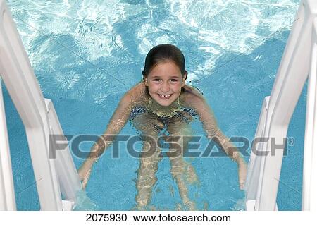 Young Girl Climbing A Swimming Pool Ladder; Ontario Canada View Large Photo Image Stock Image - Young Girl Climbing A Swimming Pool Ladder; Ontario Canada. Fotosearch