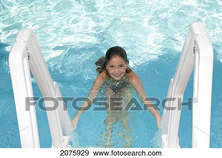 Young Girl Climbing A Swimming Pool Ladder; Ontario Canada View Large Photo Image Stock Photo - Young Girl Climbing A Swimming Pool Ladder; Ontario Canada. Fotosearch