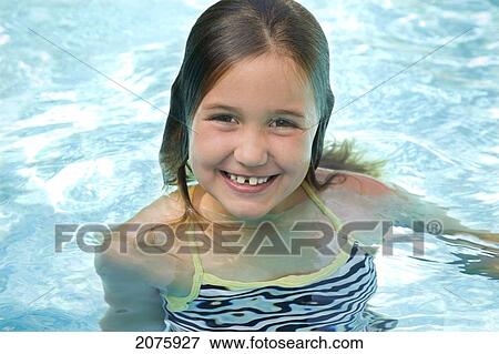 Stock Photo - Young Girl In A Swimming Pool; Ontario Canada. Fotosearch