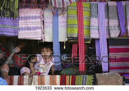 Young Girl In Stall For Cloth For Sale, Bolaven Plateau, Champasak Province, Laos View Large Photo Image Stock Image - Young Girl In Stall For Cloth For Sale, Bolaven Plateau, Champasak Province, Laos. Fotosearch