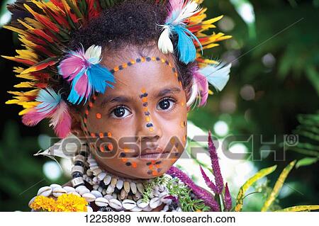 Stock Photo - Young girl in Tufi traditional costume; Tufi, Milne Bay Province, Papua New Guinea. Fotosearch