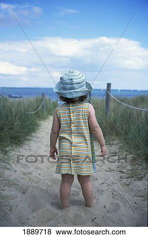 Young Girl On The Path Through Sand Dunes On Beach View Large Photo Image Stock Photo - Young Girl On The Path Through Sand Dunes On Beach. Fotosearch