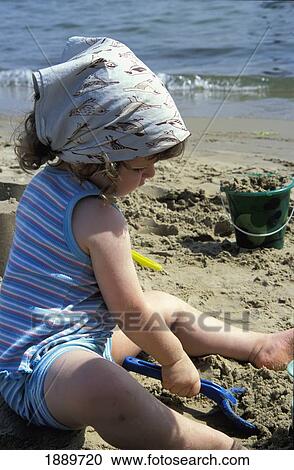 Young Girl Playing On Sandy Beach View Large Photo Image Stock Image - Young Girl Playing On Sandy Beach. Fotosearch