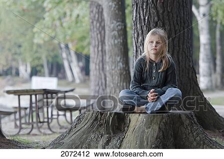 Young Girl Sitting Quietly On Large Tree Stump In Bon Echo Provincial Park, Ontario, Canada View Large Photo Image Stock Image - Young Girl Sitting Quietly On Large Tree Stump In Bon Echo Provincial Park, Ontario, Canada. Fotosearch