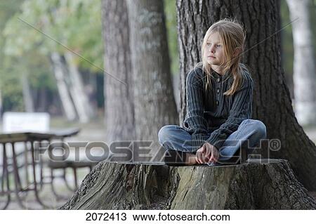 Young Girl Sitting Quietly On Large Tree Stump In Bon Echo Provincial Park, Ontario, Canada View Large Photo Image Stock Image - Young Girl Sitting Quietly On Large Tree Stump In Bon Echo Provincial Park, Ontario, Canada. Fotosearch
