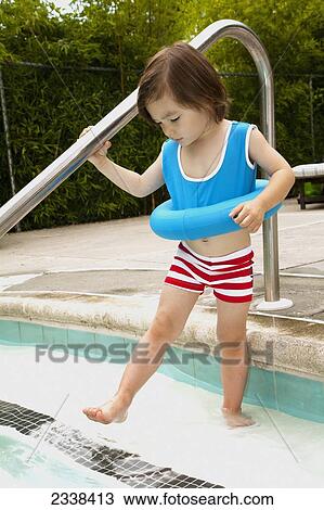 Young Girl Steps Into Swimming Pool Wearing Life Ring; San Francisco, California, Usa View Large Photo Image Stock Image - Young Girl Steps Into Swimming Pool Wearing Life Ring; San Francisco, California, Usa. Fotosearch