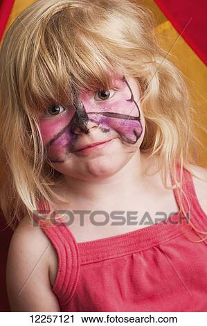 Stock Image - Young girl with butterfly painted on face; Millet, Alberta, Canada. Fotosearch