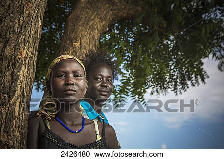Young girls from the Nuer tribe, close to Gambella, Western Ethiopia; Ethiopia View Large Photo Image Stock Image - Young girls from the Nuer tribe, close to Gambella, Western Ethiopia; Ethiopia. Fotosearch