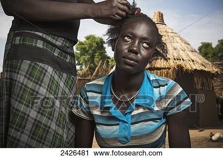 Stock Image - Young girls from the Nuer tribe, close to Gambella in western Ethiopia; Ethiopia. Fotosearch