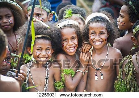 Young girls smiling at Milne Bay Canoe Festival; Milne Bay, Papua New Guinea View Large Photo Image Stock Image - Young girls smiling at Milne Bay Canoe Festival; Milne Bay, Papua New Guinea. Fotosearch