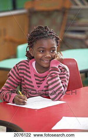 Young Grade 2 Girl Working At Her Desk; Toronto Ontario Canada View Large Photo Image Stock Image - Young Grade 2 Girl Working At Her Desk; Toronto Ontario Canada. Fotosearch