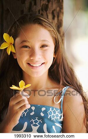 Young Hapa Hawaiian Girl Holding Flower. View Large Photo Image Stock Image - Young Hapa Hawaiian Girl Holding Flower.. Fotosearch