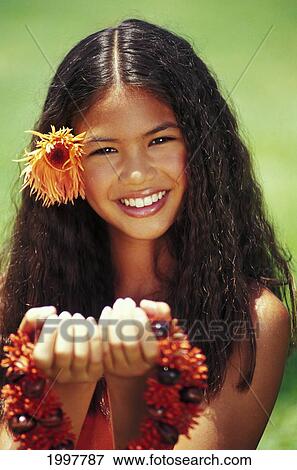 Young Hawaiian Girl Holding Up Orange Lei View Large Photo Image Stock Photo - Young Hawaiian Girl Holding Up Orange Lei. Fotosearch