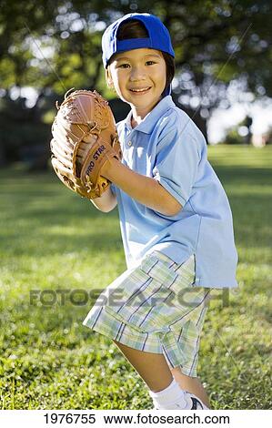 Stock Photography - Young Japanese Child Posing For Portrait With Baseball Glove.. Fotosearch