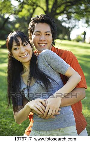Young Japanese Couple Posing Together. View Large Photo Image Stock Photo - Young Japanese Couple Posing Together.. Fotosearch