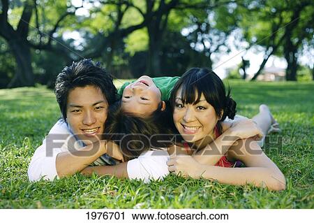 Young Japanese Family Posing Together. View Large Photo Image Stock Image - Young Japanese Family Posing Together.. Fotosearch