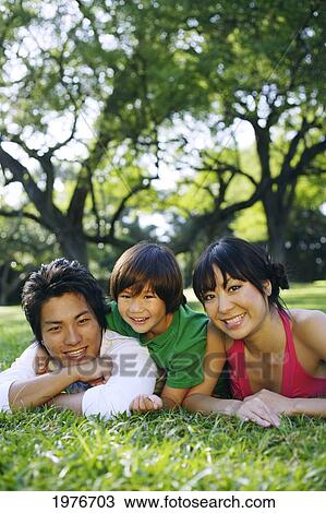 Stock Image - Young Japanese Family Posing Together.. Fotosearch