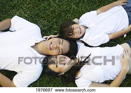 Stock Photo - Young Japanese Family Posing Together.. Fotosearch