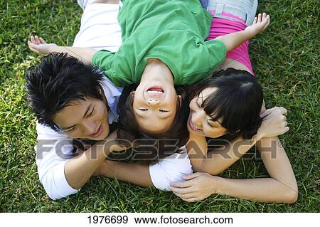 Young Japanese Family Posing Together. View Large Photo Image Stock Photo - Young Japanese Family Posing Together.. Fotosearch