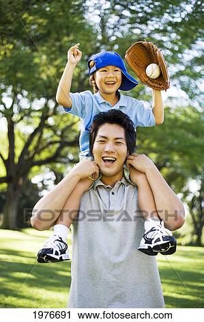 Young Japanese Father And Child Playing With Baseball. View Large Photo Image Stock Image - Young Japanese Father And Child Playing With Baseball.. Fotosearch