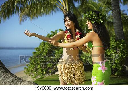 Stock Image - Young Japanese Girl Learning Hula.. Fotosearch