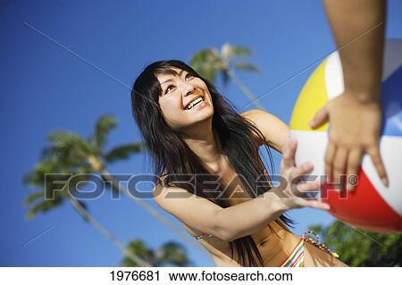 Young Japanese Girl Playing With Beach Ball. View Large Photo Image Stock Image - Young Japanese Girl Playing With Beach Ball.. Fotosearch