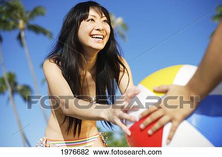 Young Japanese Girl Playing With Beach Ball. View Large Photo Image Stock Image - Young Japanese Girl Playing With Beach Ball.. Fotosearch