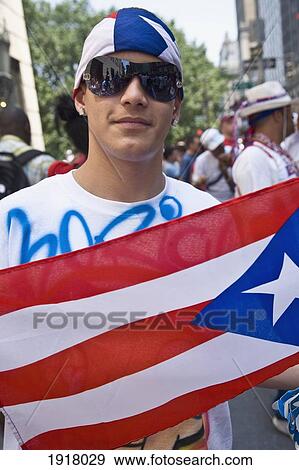 Stock Photo - Young Man At Puerto Rico Day Parade. Fotosearch