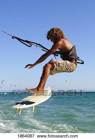 Stock Photo - Young Man Kite Surfing; Costa De La Luz, Andalusia, Spain. Fotosearch