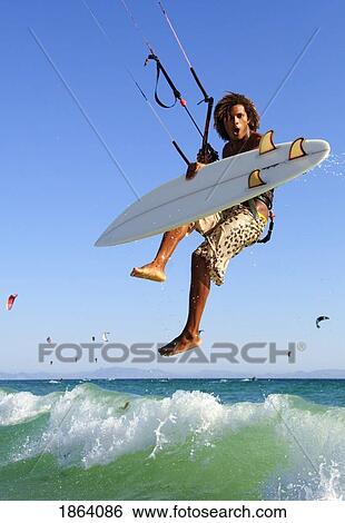 Stock Photograph - Young Man Kite Surfing; Costa De La Luz, Andalusia, Spain. Fotosearch