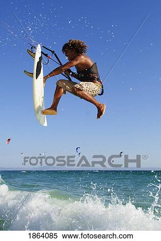 Young Man Kite Surfing; Costa De La Luz, Andalusia, Spain View Large Photo Image Stock Photography - Young Man Kite Surfing; Costa De La Luz, Andalusia, Spain. Fotosearch