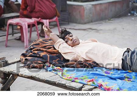 Stock Photo - Young Man Lying On A Charpoy, Bodhgaya, Bihar, India. Fotosearch