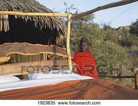 Young Man Standing Beside Bed View Large Photo Image Stock Photography - Young Man Standing Beside Bed. Fotosearch