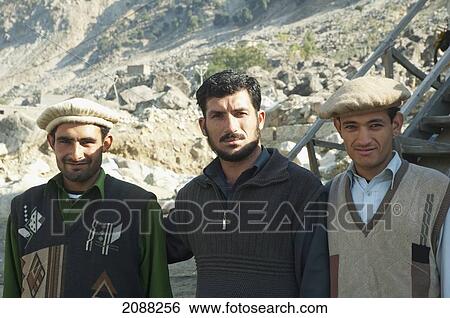 Stock Photograph - Young Men, Dasu, North-West Frontier Province, Pakistan. Fotosearch