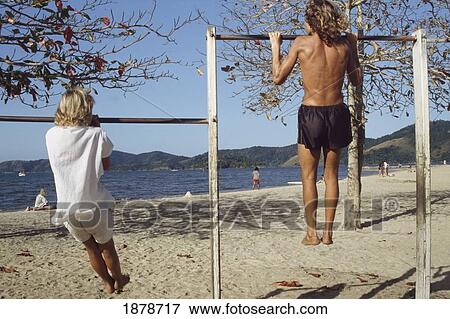 Young Men Exercising On Beach View Large Photo Image Stock Photo - Young Men Exercising On Beach. Fotosearch
