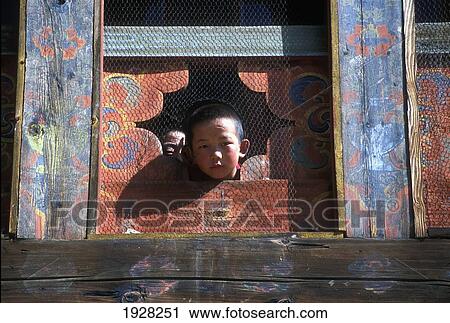 Young Monk And His Friend Peer Out Of A High Monastery Window At Phajoding Monastery; Thimphu, Thimphu District, Bhutan View Large Photo Image Stock Image - Young Monk And His Friend Peer Out Of A High Monastery Window At Phajoding Monastery; Thimphu, Thimphu District, Bhutan. Fotosearch