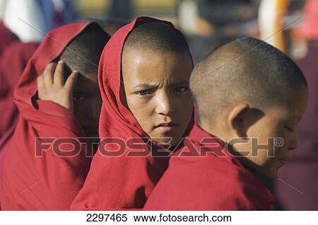 Stock Photography - Young monks at the Dalai Lama's Teachings. The Dalai Lama visited Leh, Ladakh - a Buddhist enclave in northern India, for four days in August. Fotosearch