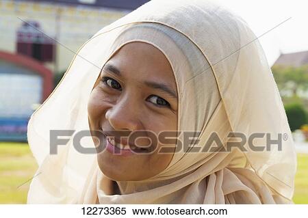 Young Muslim woman, Fort Rotterdam, Makassar (Ujung Pandang), South Sulawesi, Indonesia View Large Photo Image Stock Photography - Young Muslim woman, Fort Rotterdam, Makassar (Ujung Pandang), South Sulawesi, Indonesia. Fotosearch