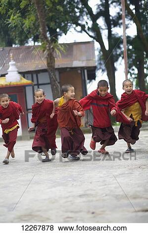 Young novice monks racing at Rumtek Monastery; Gangtok, Sikkim, India View Large Photo Image Stock Photo - Young novice monks racing at Rumtek Monastery; Gangtok, Sikkim, India. Fotosearch