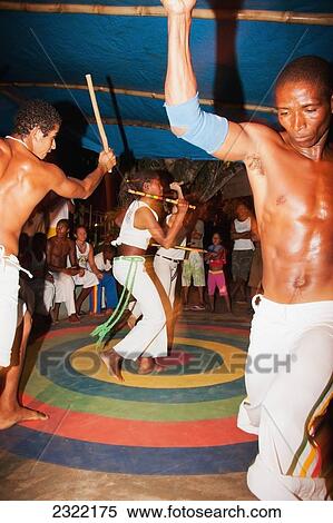 Stock Photography - Young people practicing Brazilian dance and martial arts form of Capoeira; Itacare, Bahia, Brazil. Fotosearch