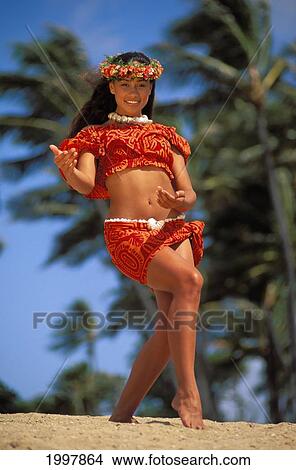Picture - Young Polynesian Hula Dancer On Beach, Palm Trees And Blue Sky In Blur Background. Fotosearch
