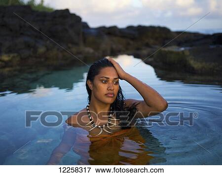 Stock Photo - Young Samoan woman bathing; Samoa. Fotosearch