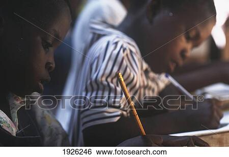 Young Students Writing At School View Large Photo Image Stock Photograph - Young Students Writing At School. Fotosearch