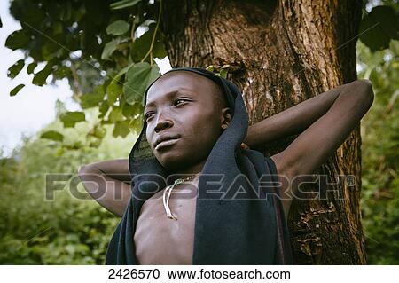 Stock Image - Young Suri boy, Omo region, Southwest Ethiopia; Kibish, Ethiopia. Fotosearch