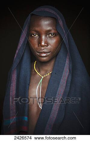 Picture - Young Suri (Surma) boy in a village, Omo region, Southwest Ethiopia; Kibish, Ethiopia. Fotosearch