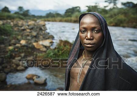 Young Suri (Surma) man in a village, Omo region, Southwest Ethiopia; Kibish, Ethiopia View Large Photo Image Stock Photo - Young Suri (Surma) man in a village, Omo region, Southwest Ethiopia; Kibish, Ethiopia. Fotosearch