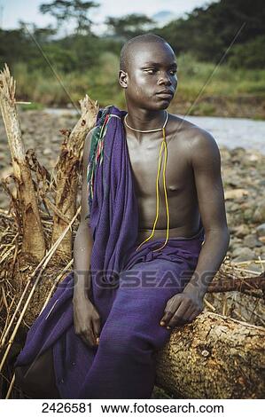 Young Suri (Surma) man in village of Kibish, Omo region, Southwest Ethiopia; Kibish, Ethiopia View Large Photo Image Stock Image - Young Suri (Surma) man in village of Kibish, Omo region, Southwest Ethiopia; Kibish, Ethiopia. Fotosearch